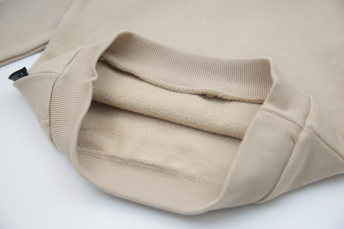 Close-up of brushed terry fabric and hood detail – wheat kids hoodie
