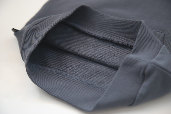 Close-up of organic french terry fabric texture – fjord blue kids sweatpants
