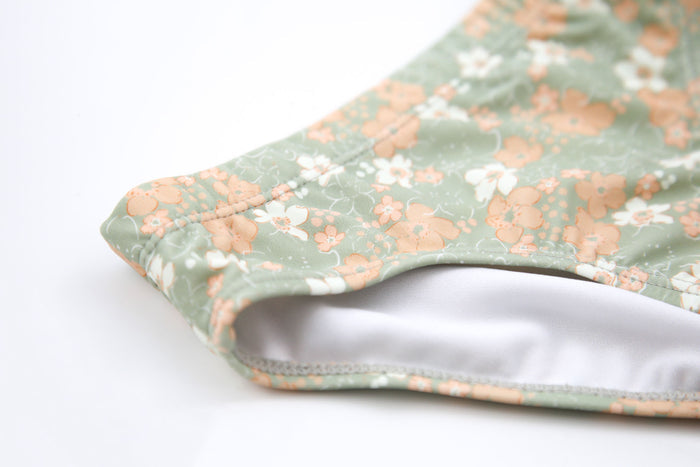 Close-up of quick-dry sage green fabric – Evangelina swim bottom