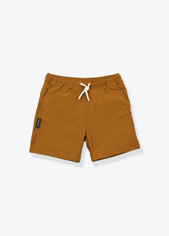 Boys swim trunks in ginger red – front view