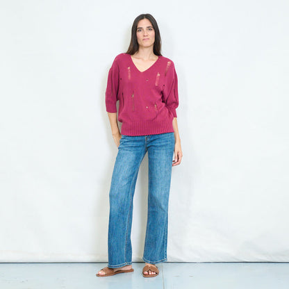 Distressed v-neck knitted sweater with torn details wholesale
