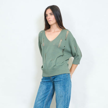 Distressed v-neck knitted sweater with torn details wholesale