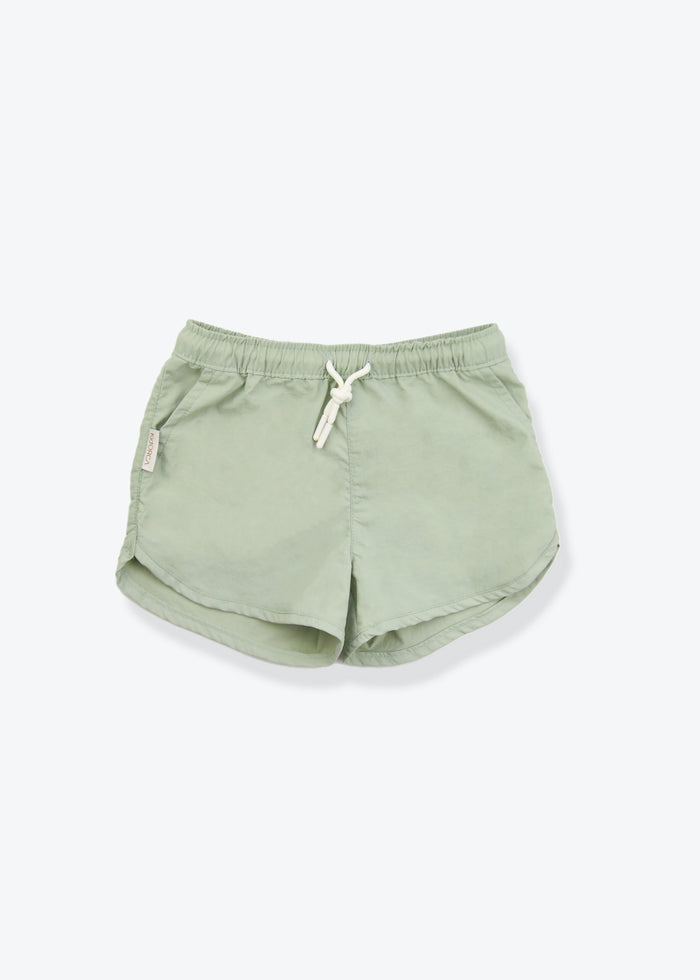 Girls swim trunks in sage green – front view