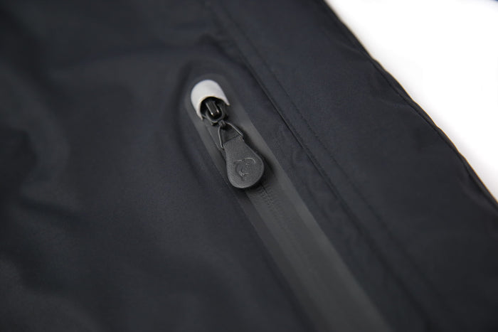 Taped seams and waterproof zipper detail – black insulated jacket