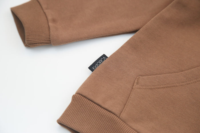 Kangaroo pocket and rib cuff detail on fjord french terry kids hoodie