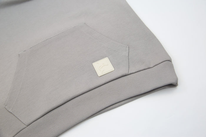 Kangaroo pocket and rib cuff detail on pebble french terry kids hoodie