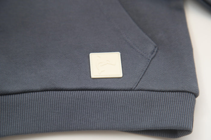 Kangaroo pocket and rib cuff detail on fjord french terry kids hoodie