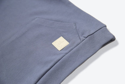 Kangaroo pocket and rib cuff detail on flint french terry kids hoodie