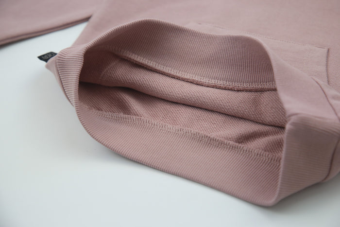 Close-up of f​​rench terry fabric and hood detail – mauve kids hoodie