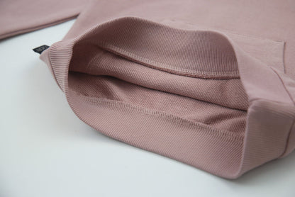 Close-up of f​​rench terry fabric and hood detail – mauve kids hoodie