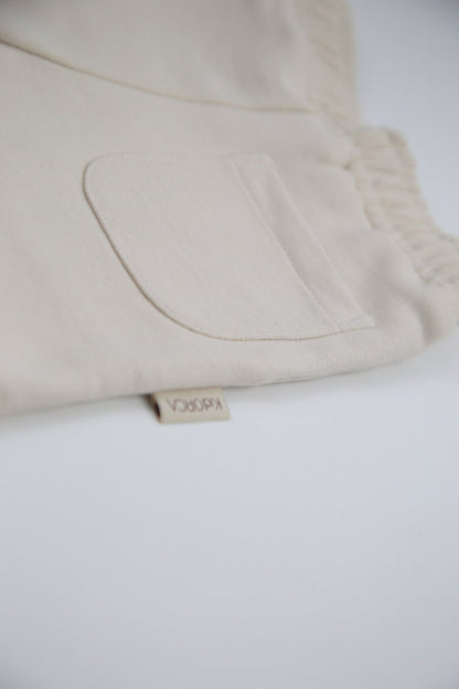 Close-up of french terry fabric and elastic waistband – oat kids shorts