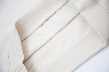 Hem and seam detail on oat french terry kids shorts