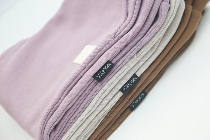 Close-up of brushed terry fabric and tapered fit – wheat kids sweatpants