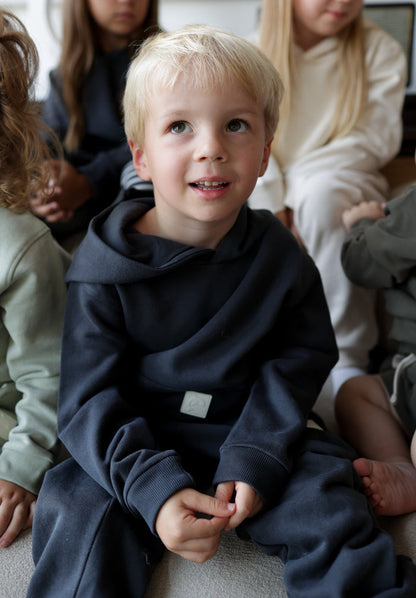 Child wearing lava brushed terry sweatpants – side view with elastic waist