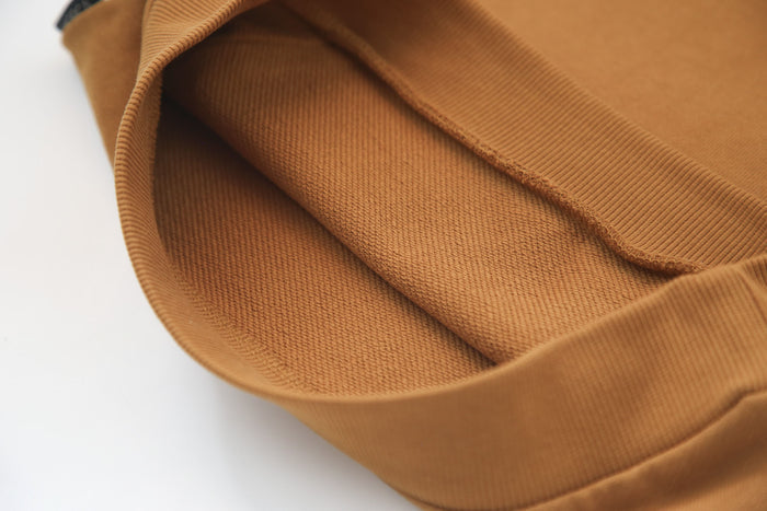 Close-up of organic french terry fabric texture – ginger kids sweatpants