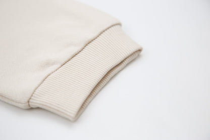Rib cuff and elastic waistband detail on oat french terry kids sweatpants