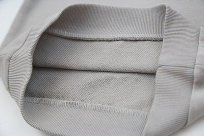 Close-up of organic french terry fabric texture – pebble grey kids sweatpants