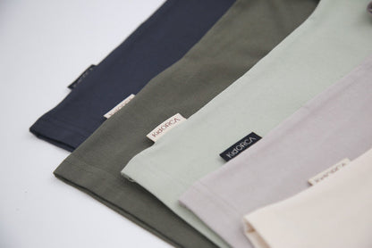 Seam and hem detail on dove grey kids tee