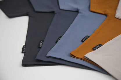 Close-up of organic cotton fabric on lava kids tee