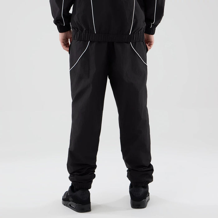 The model is wearing these MLB Piping Track LA Dodgers Track Pants in black. 2