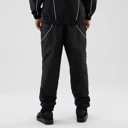 The model is wearing these MLB Piping Track LA Dodgers Track Pants in black. 2