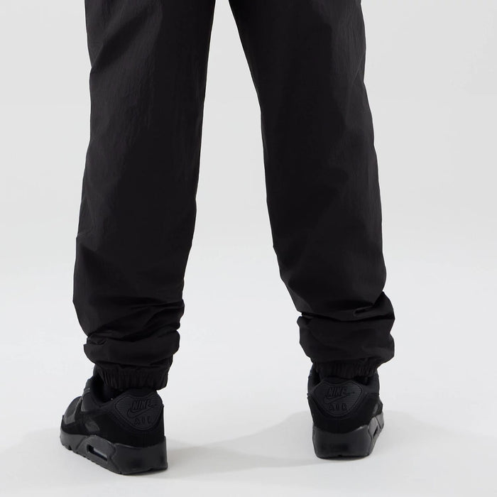 The model is wearing these MLB Piping Track LA Dodgers Track Pants in black. 4