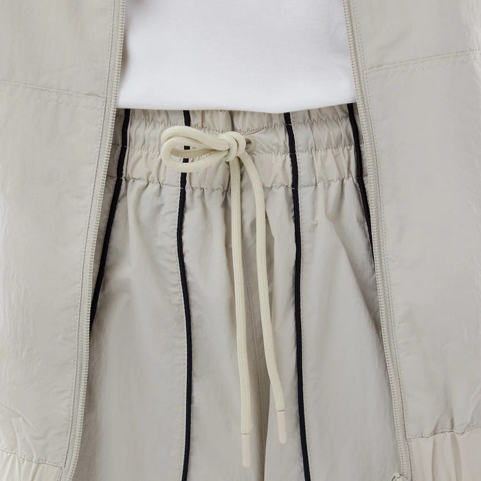 The model is wearing these MLB Piping Track New York Yankees Track Pants in cream. 6