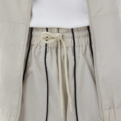 The model is wearing these MLB Piping Track New York Yankees Track Pants in cream. 6
