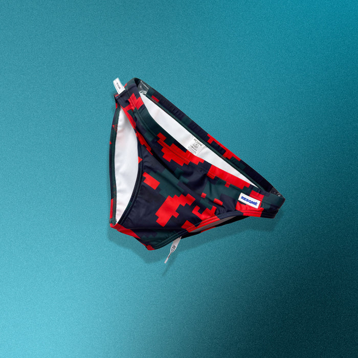 Red and black patterned underwear on a teal background