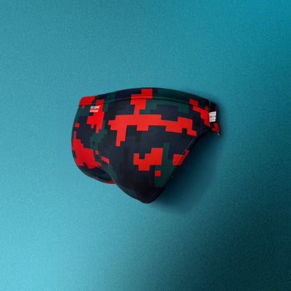 Pixelated swim briefs with red and green pattern on a teal background