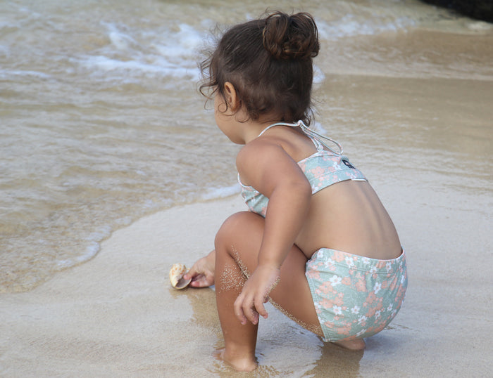 Girl wearing Evangelina sage swim bottom – side view