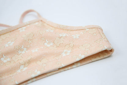 Close-up of Tuscany-print quick-dry fabric – Evangelina swim top