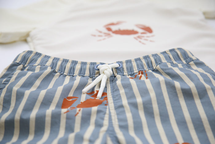 Elastic waistband detail on crab slate boys swim trunks
