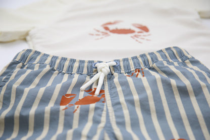 Elastic waistband detail on crab slate boys swim trunks