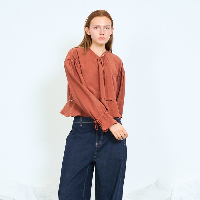 Tie-neck lace-trim peplum blouse with flared cuffs wholesale