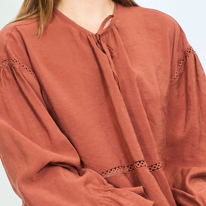 Tie-neck lace-trim peplum blouse with flared cuffs wholesale