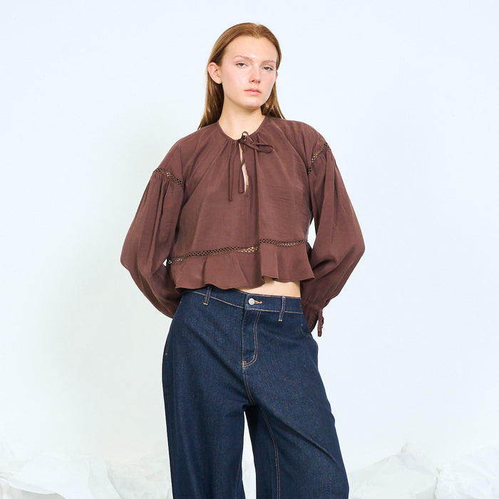 Tie-neck lace-trim peplum blouse with flared cuffs wholesale