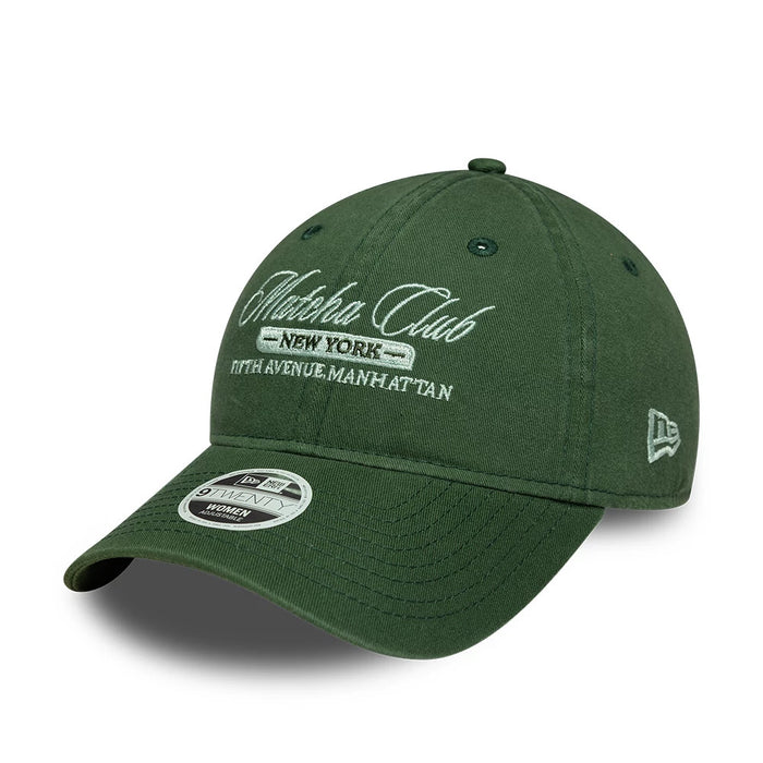 Pictured is this Womens New Era Café Slogan 9TWENTY cap in dark green. 1